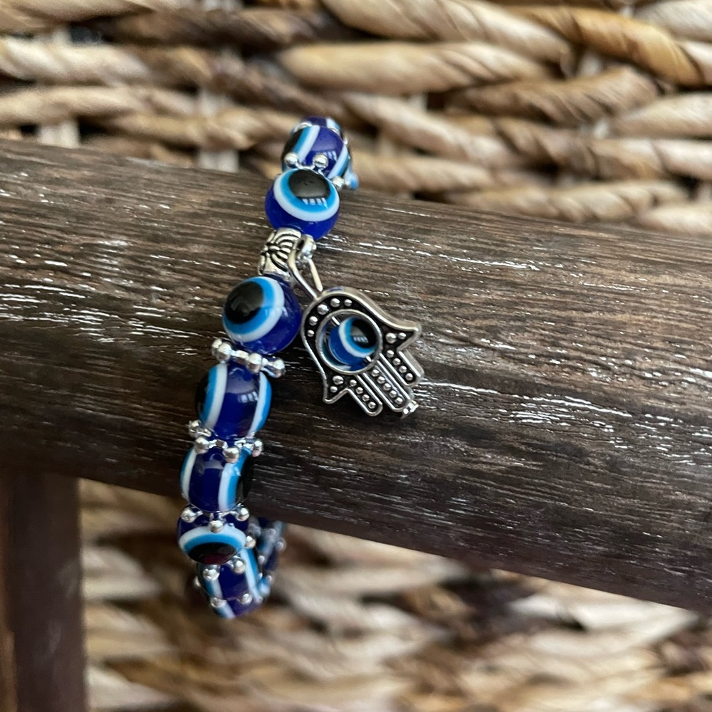 Evil Eye Beaded Bracelet. Blue beads adorn this bracelet with an evil eye charm.